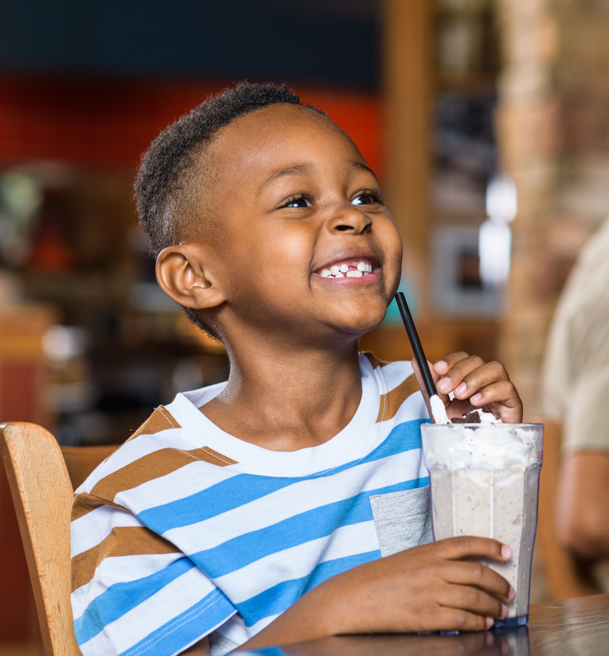 Smiling young Guest enjoying a shake