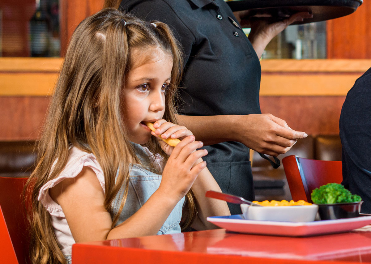 Young Guest enjoying Steak Fries