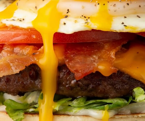 Close-up of egg yolk drip on Royal Red Robin