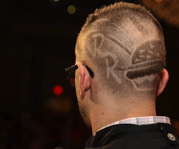 Red Robin logo and burger hairdo