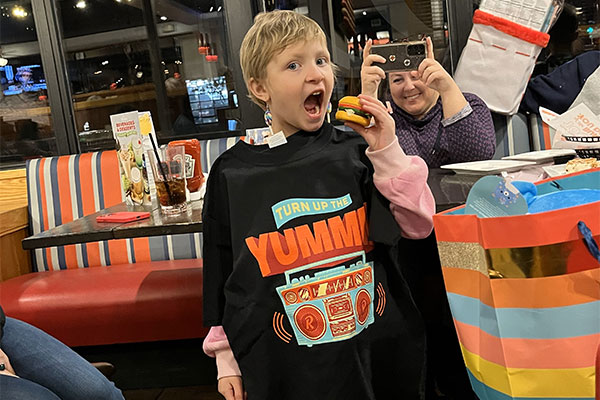 Young girl enjoying her wish reveal at Red Robin