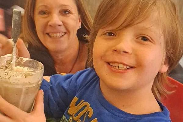 Young boy enjoying his wish reveal at Red Robin