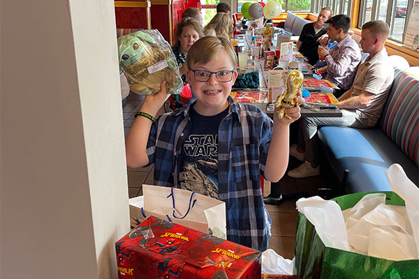 Young boy enjoying his wish reveal at Red Robin