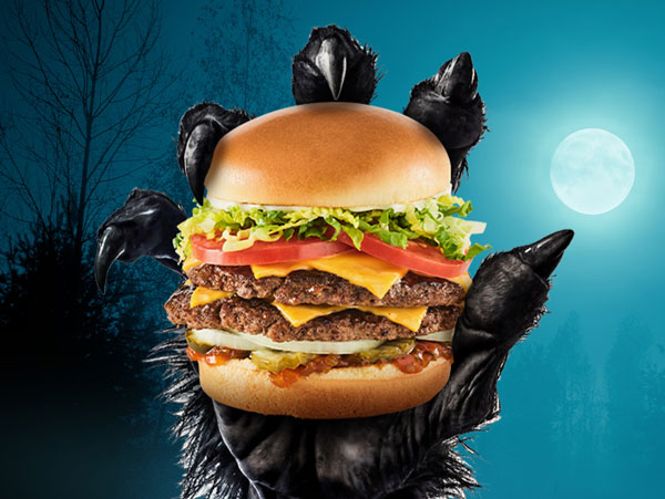 Werewolf holding a Monster Burger under a full moon
