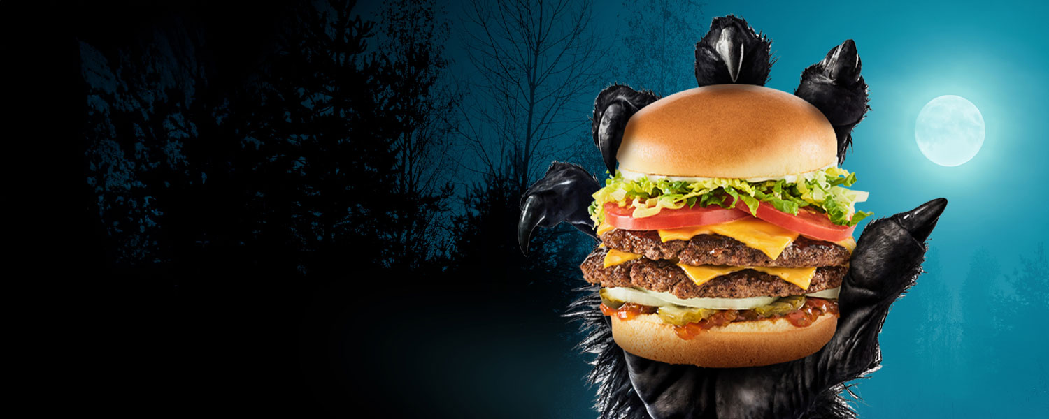 Werewolf holding a Monster Burger under a full moon