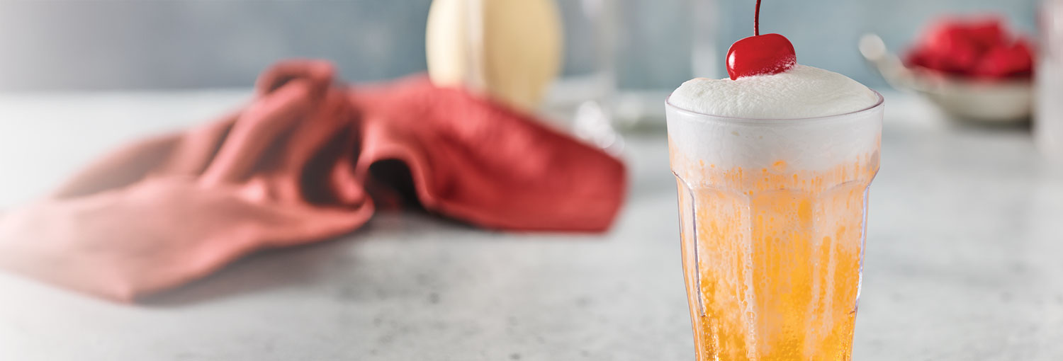 Kids Candied Orange Fizzy Soda with cold foam