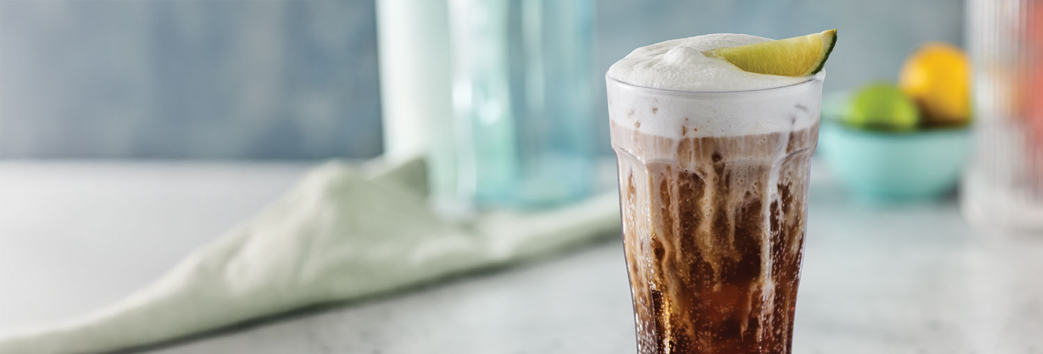 Coconut Coca-Cola Fizzy Soda with cold foam