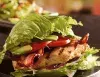 Lettuce-wrapped grilled chicken sandwich with tomato, bacon and avocado