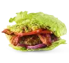 Lettuce-wrapped gourmet burger with bacon and guacamole