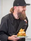 Team Member presenting his burger creation