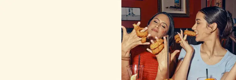 Mom and daughter enjoying Red Robin onion rings