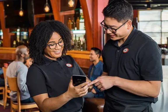 Team Members consulting an order
