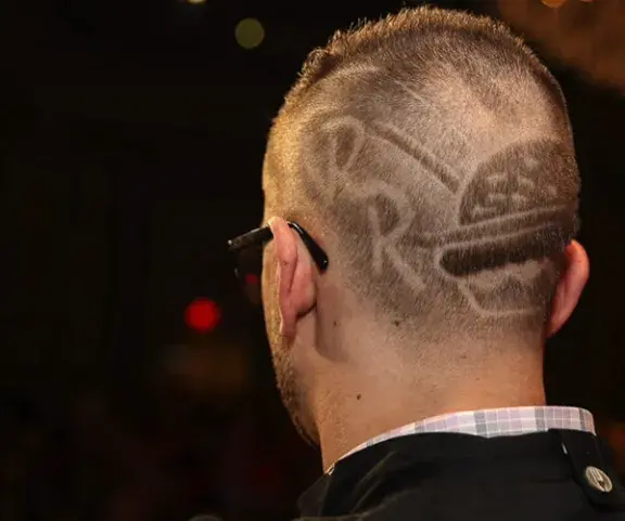 Red Robin logo and burger hairdo