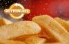 Red Robin seasoning being sprinkled on Bottomless Steak Fries